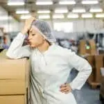 A female food factory worker having failure at work.
