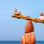 Balanced Rock Zen on the background of the sea. The concept of fall risk and unstable equilibrium