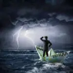 Businessman on euro boat in the storm