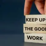 Keep up the good work, text is written on wooden blocks, Business concept, Motivating slogan, work commitment, copy space