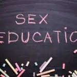 The word sex education written in chalk on a blackboard