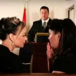 Two women talking during a Eulogy!
