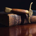 Ancient sword beside a 150 Year Old Bible